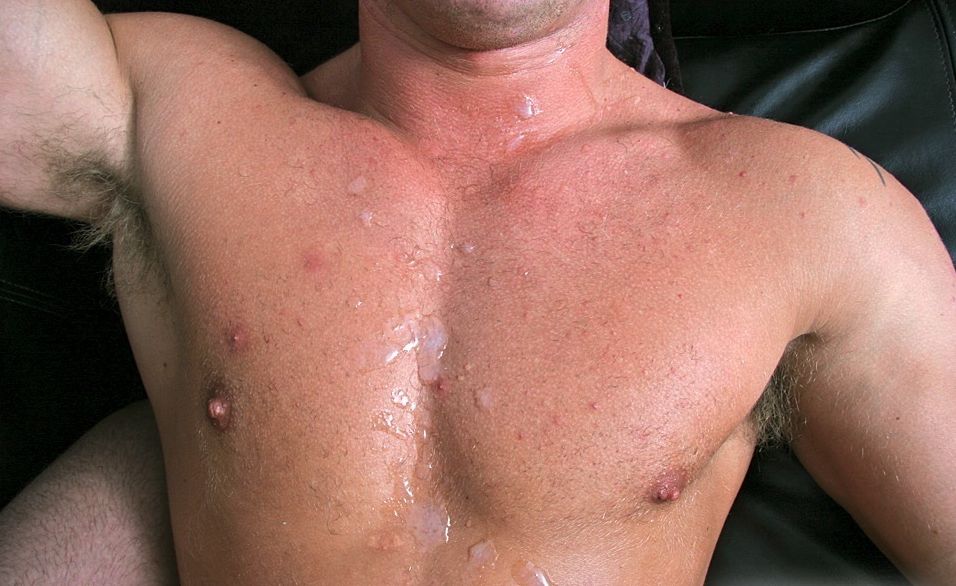 Smooth muscle boy chest covered with cum