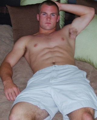 Smooth muscle boy Ian laying shirtless