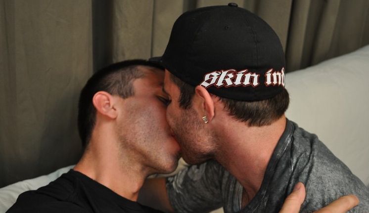 Scruffy hot young men kissing