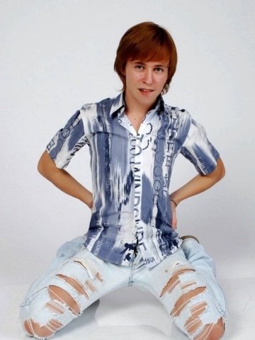Young red headed twink sitting on the floor