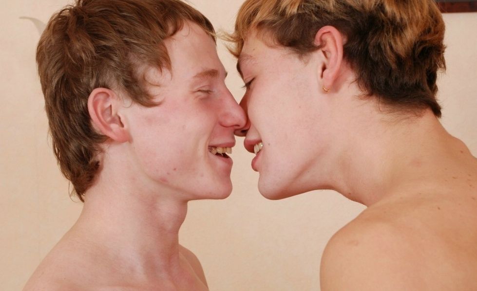 Cute young shirtless guys about to kiss