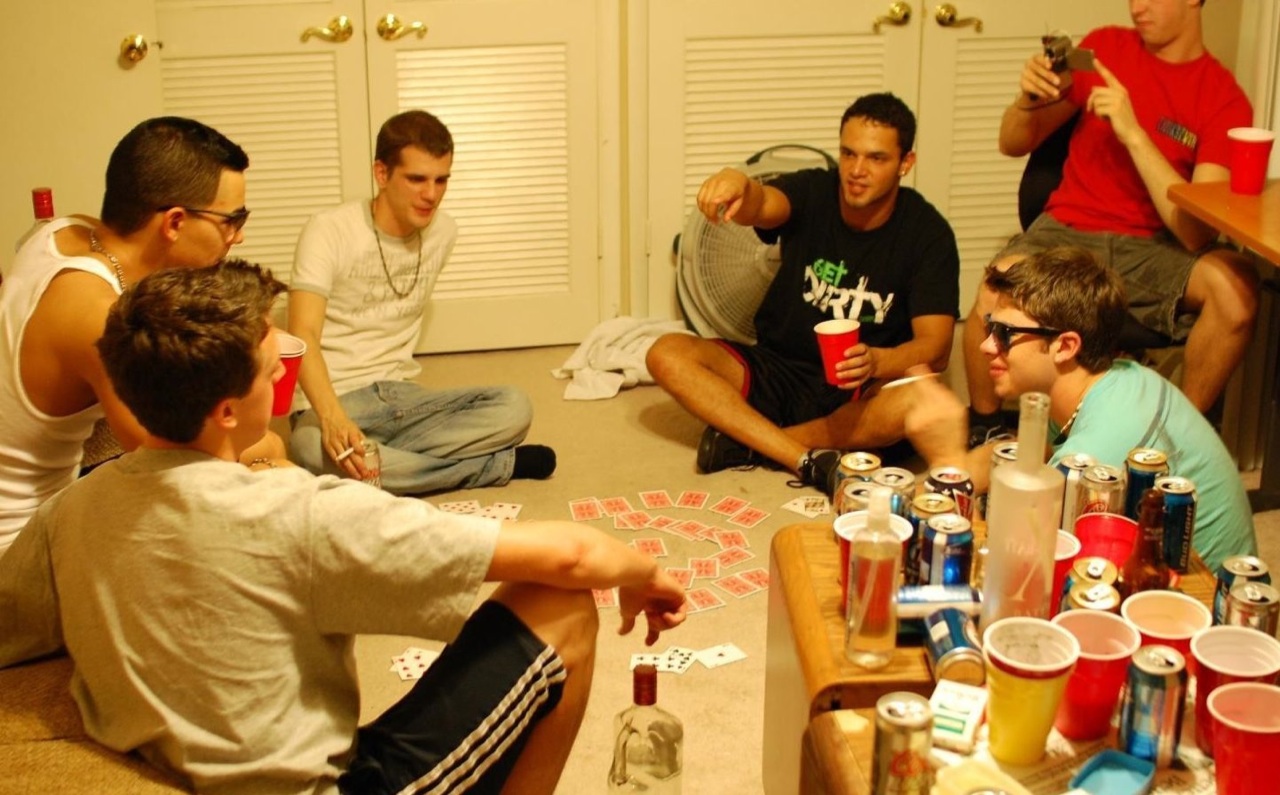 Frat boys playing cards and drinking 