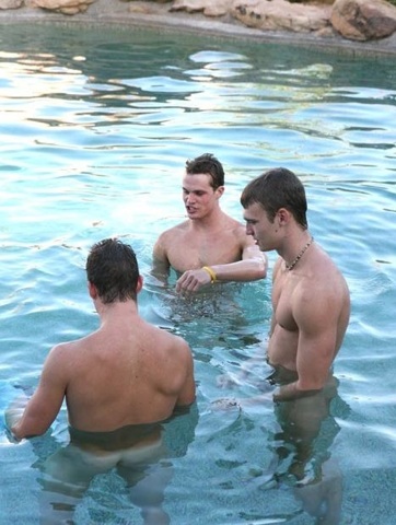 Three smooth young jock swim naked