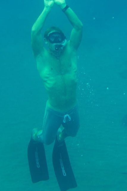 Young jock scuba diving