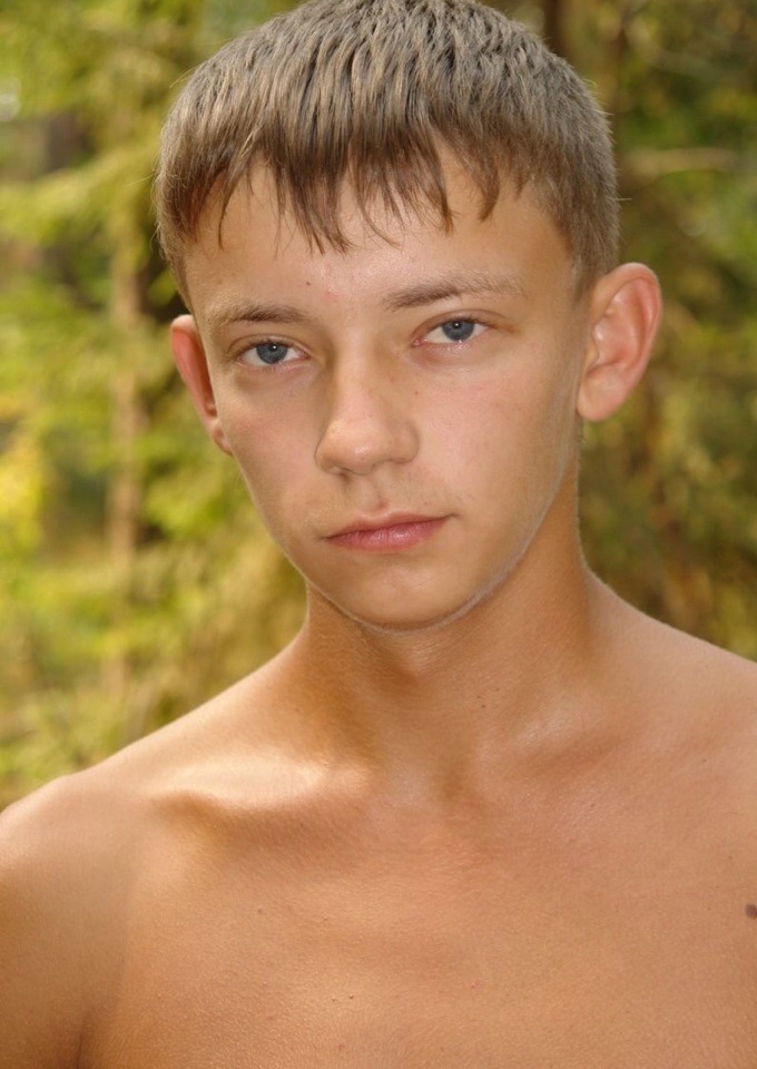 Cute young hairless boy in the woods