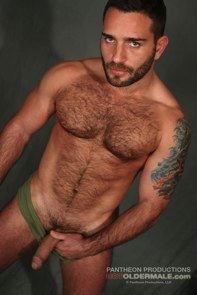 hairy chested man flashes hard cock