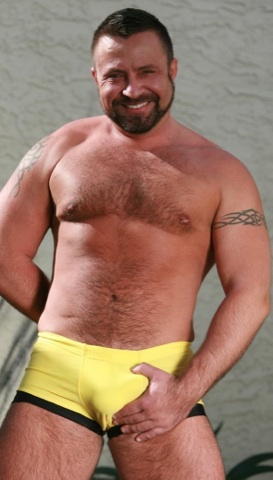 hairy daddy bear gropes himself in yellow swim trunks