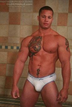 muscle hunk with tats and nipple piercing
