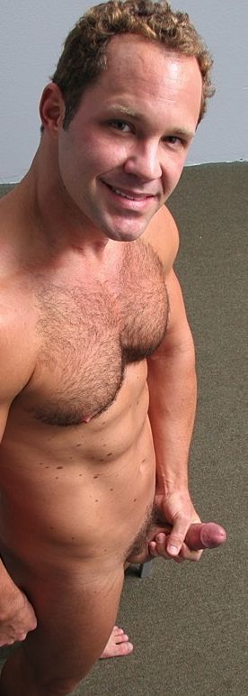 Furry chested hunk strokes his hard cock and shows off his build