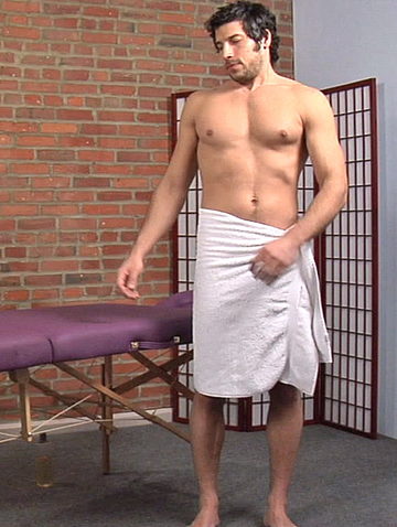 Leo Giamani in a towel about to get a massage