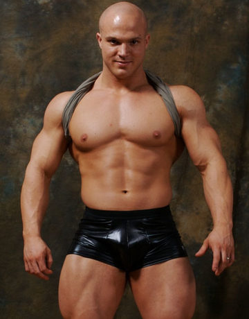 Hot young bodybuilder Kyle Stevens in rubber shorts