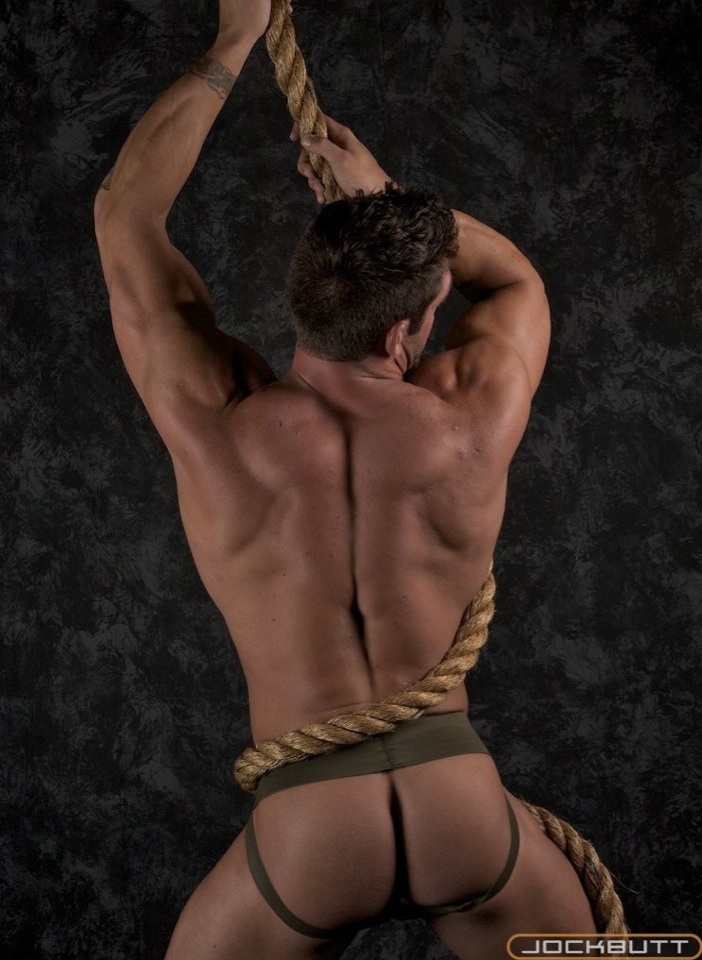 Body builder with perfect bubble ass wearing green jock