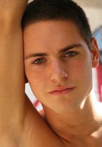 Hot young guy with beautiful green eyes