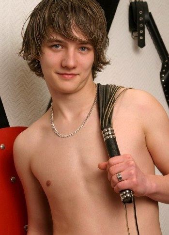 Young hairless guy with a leather flogger