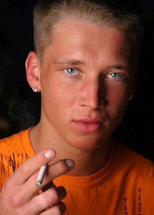 Young blond hottie smoking a cigarette