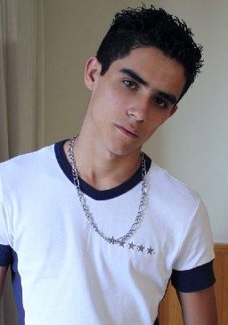 Cute young Latin twink in white t shirt