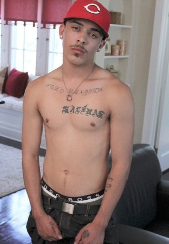 Shirtless Brazilian thug shows off his ink