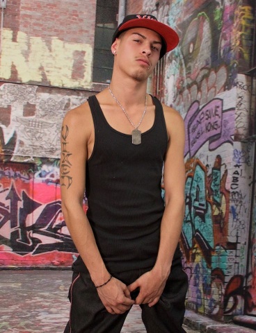 Inked Latin punk in a tank top