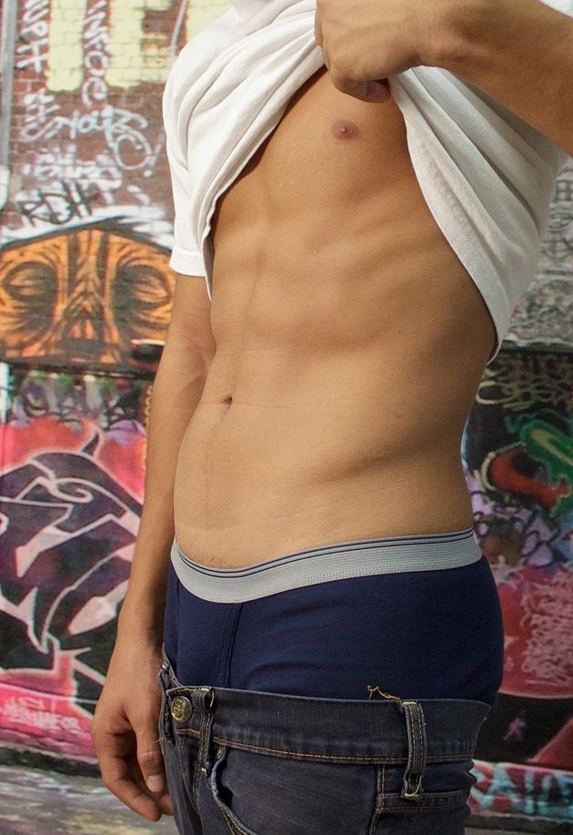 Ripped smooth abs on a hot young Latin jock