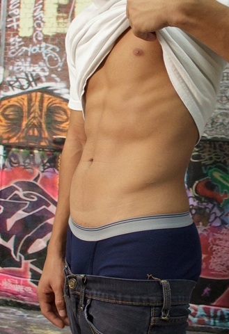 Ripped smooth abs on a hot young Latin jock