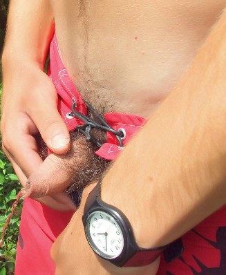 Fit guy with an uncut cock pisses in his swimming gear