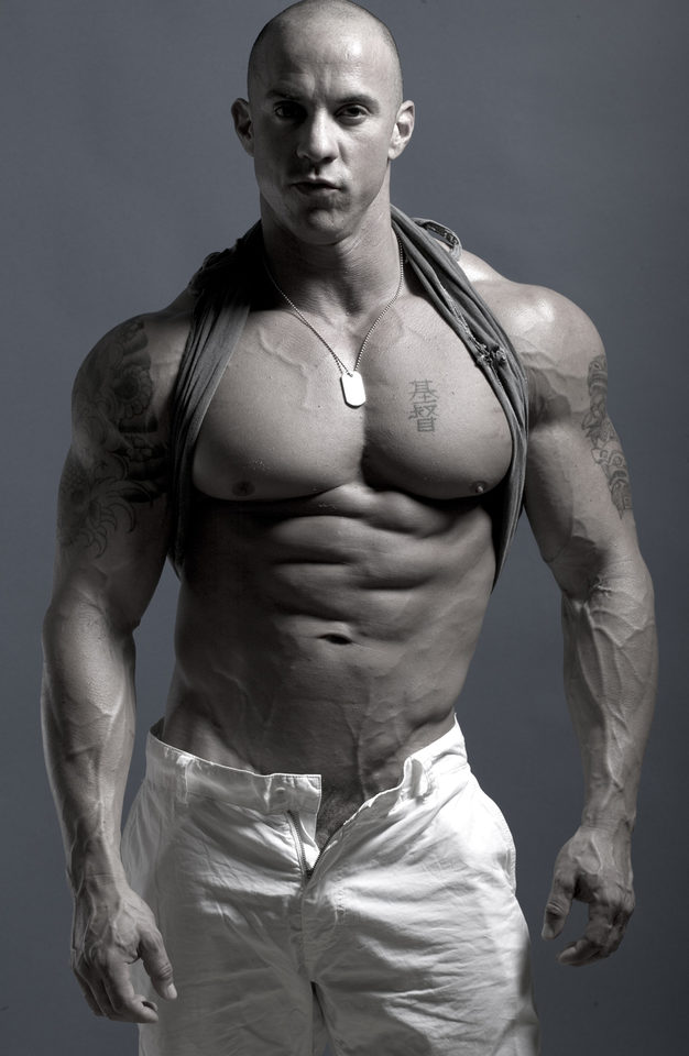 Ripped bodybuilder Vin Marco with his bad boy image complete with tattoos and a shaved head