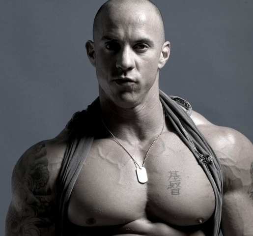 Ripped bodybuilder Vin Marco with his bad boy image complete with tattoos and a shaved head