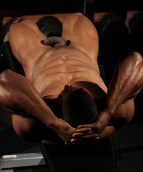 Ripped muscular body of black bodybuilder Alan Demond