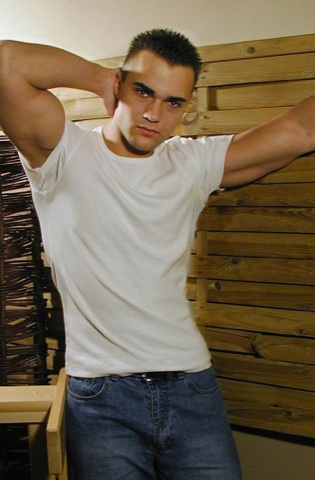 Hot young jock in T shirt and jeans