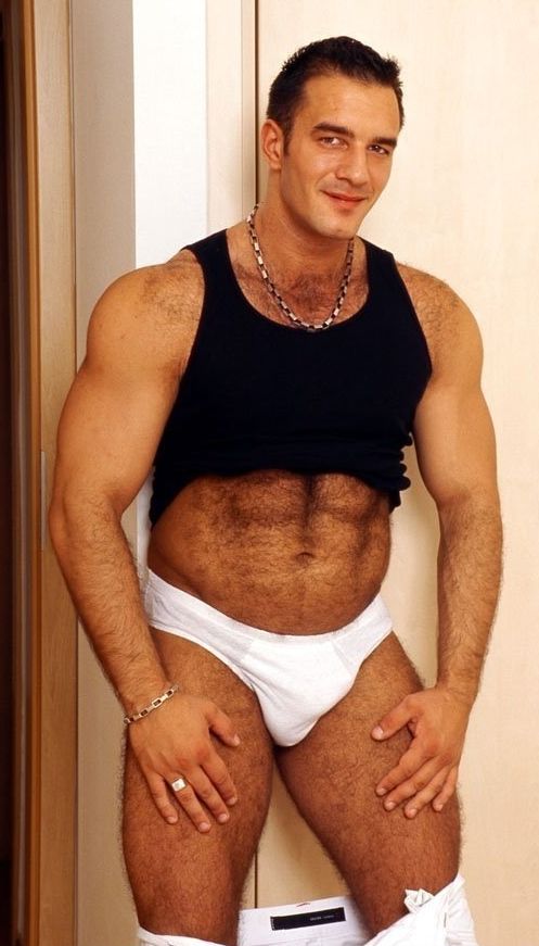 Ted Colunga shows his hairy belly belly and smiles