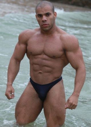 Ripped bodybuilder Lucius Blaque in the ocean