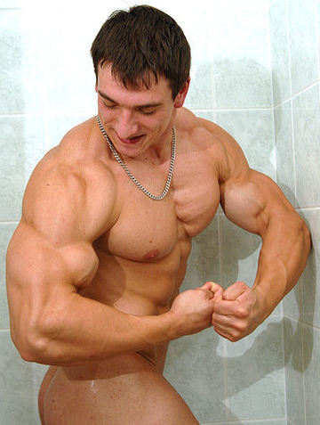 Radek flexes his huge biceps