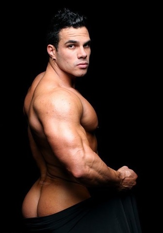Hot young bodybuilder Enzo Pileri flexing his arms