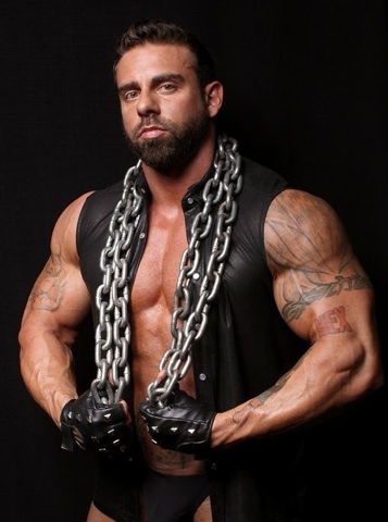 Bearded Xavier shows off his huge inked biceps