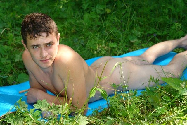 Hot naked teen lying ass up in the grass