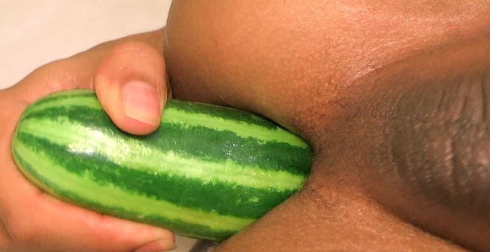Omn fucks himself with a cucumber