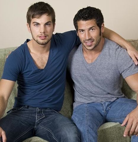 Malachi Marx and Leo Giamani arms around each other on a couch