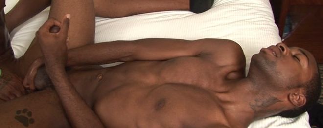 Black guy jacks off his huge cock and plays with his balls