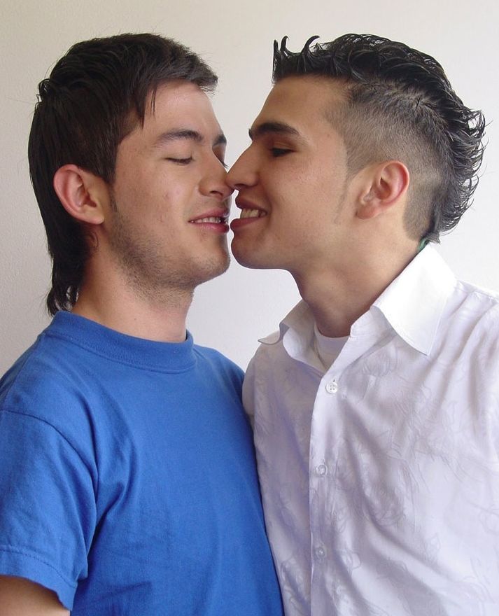 Cute young Latino boys about to kiss