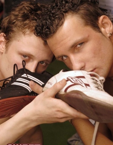 Young jocks sniff their smelly shoes