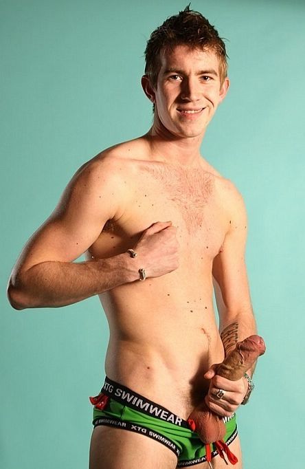 Matt Hughes smiles as he fists his huge veiny uncut cock