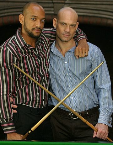 Interracial hunks pose with their cues