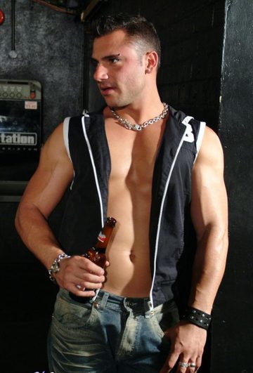 Pedro Andreas showing his hot body while drinking a beer at a sleazy bar.