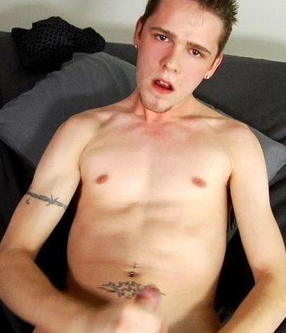 Tattooed twink Corey with a great expression on his face