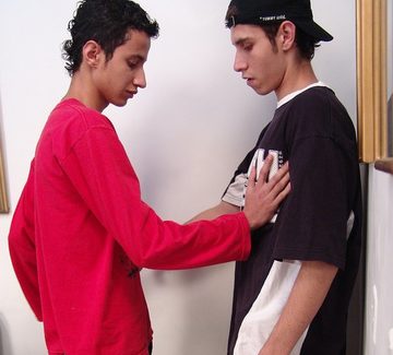 Young skinny guys in baggy clothes explore each other\'s bodies